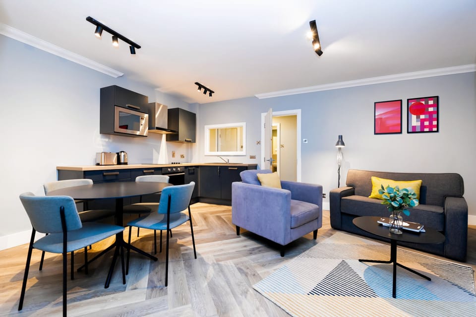 1 Bedroom Apartment | Living area | 43-inch flat-screen TV with satellite channels, TV