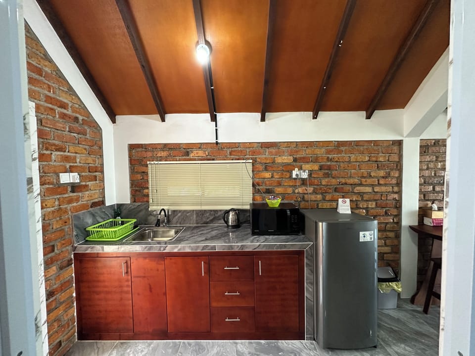 Deluxe Villa, 1 Queen Bed, Ocean View | Private kitchen | Fridge, microwave
