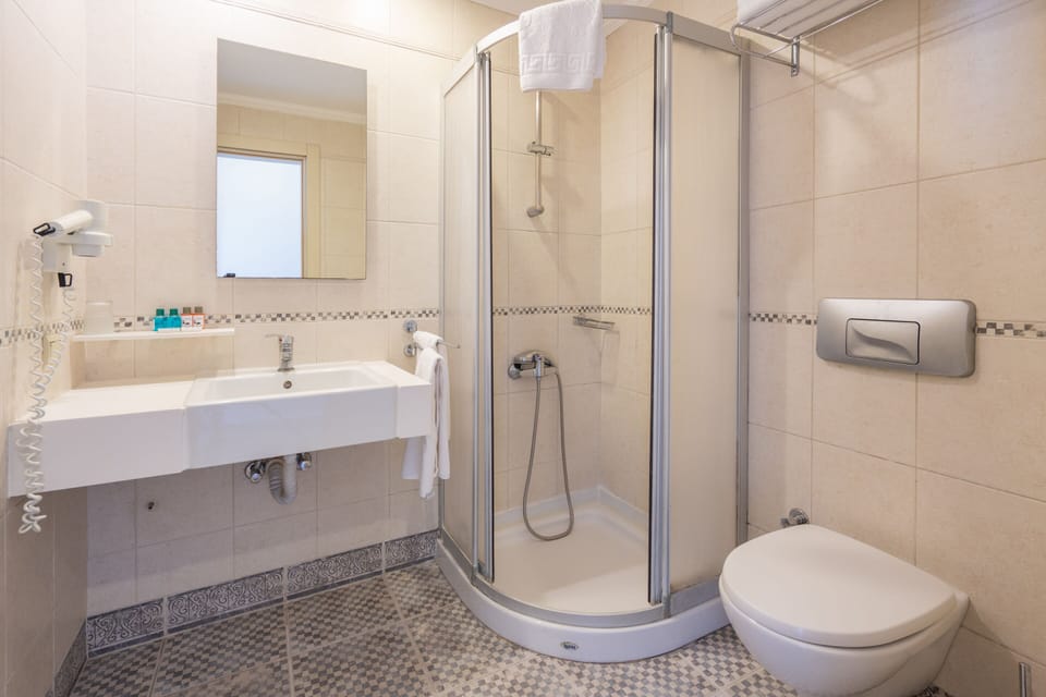 Shower, free toiletries, hair dryer, slippers