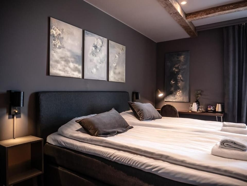 Deluxe Double Room | Minibar, desk, laptop workspace, blackout drapes