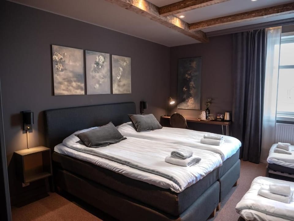 Deluxe Double Room | Minibar, desk, laptop workspace, blackout drapes