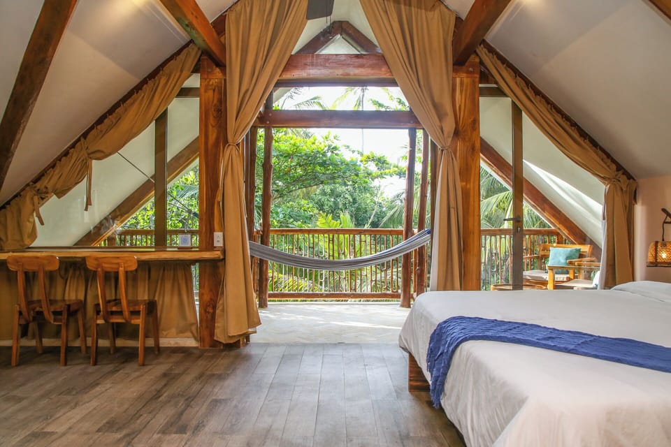 Suite, Balcony, Garden View | In-room safe, WiFi (free), bed sheets