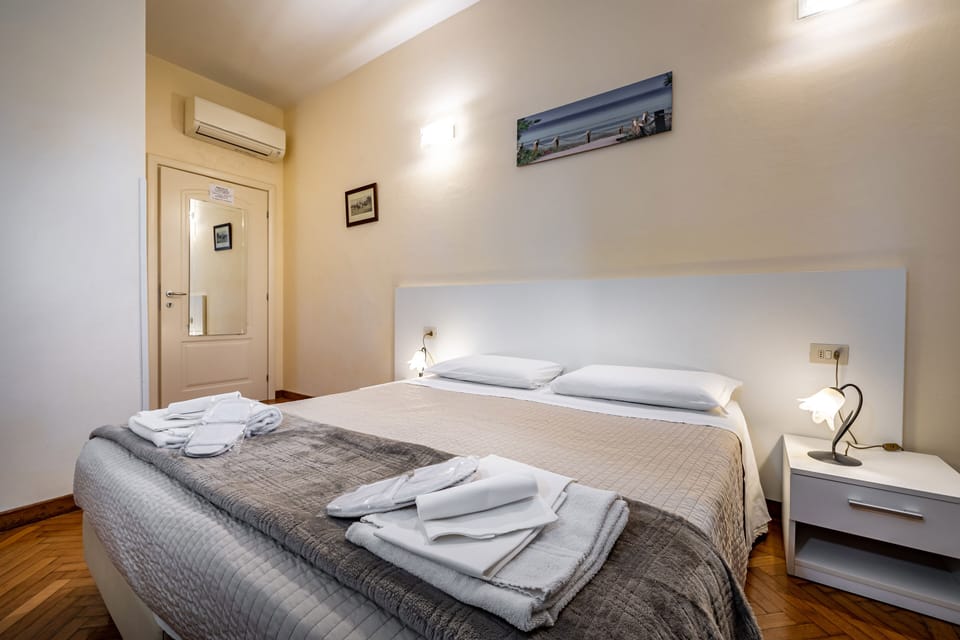 Standard Double Room | Minibar, in-room safe, desk, blackout drapes