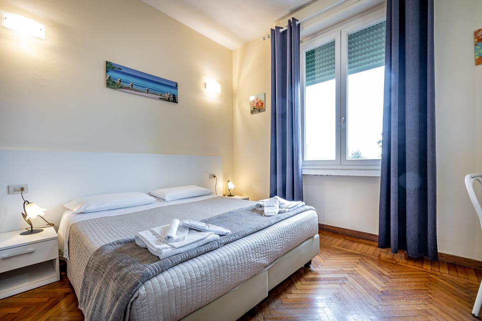 Standard Double Room | Minibar, in-room safe, desk, blackout drapes