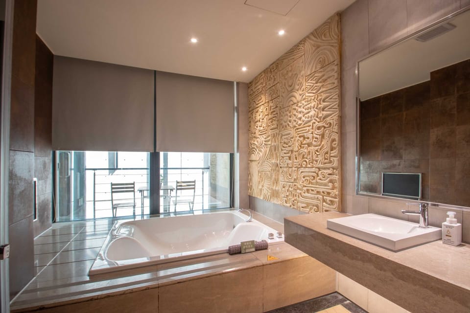 Separate tub and shower, jetted tub, hair dryer, slippers