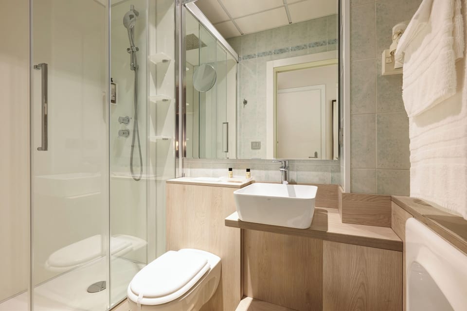 Family Room, 2 Bedrooms | Bathroom | Shower, free toiletries, hair dryer, slippers