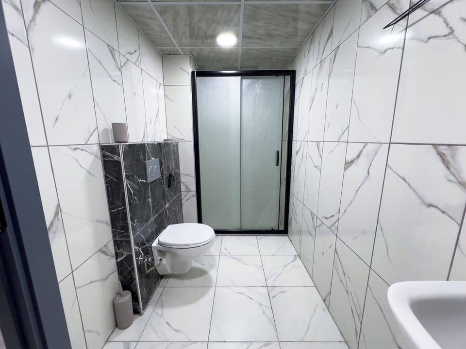 Comfort Suite, Balcony, City View | Bathroom | Shower, hair dryer, towels, soap
