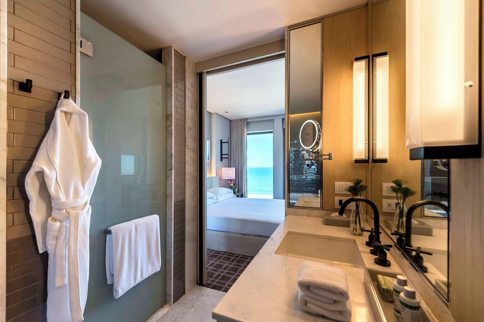 Designer toiletries, hair dryer, towels