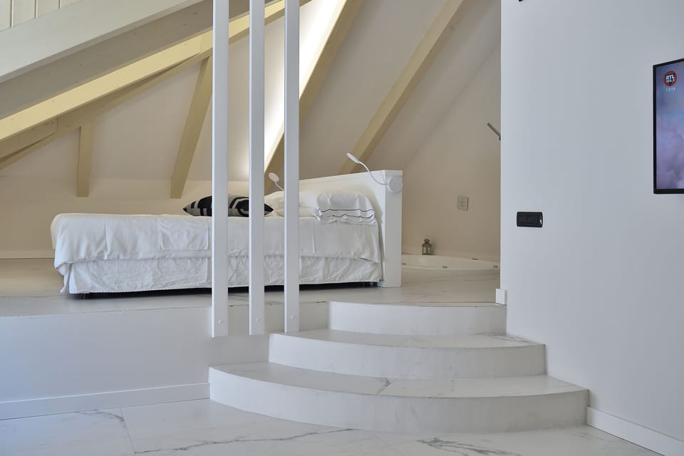 Junior Suite, Hot Tub, Sea View | Premium bedding, minibar, in-room safe, desk