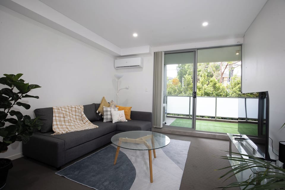 Apartment, 1 Queen Bed | Living area | Flat-screen TV