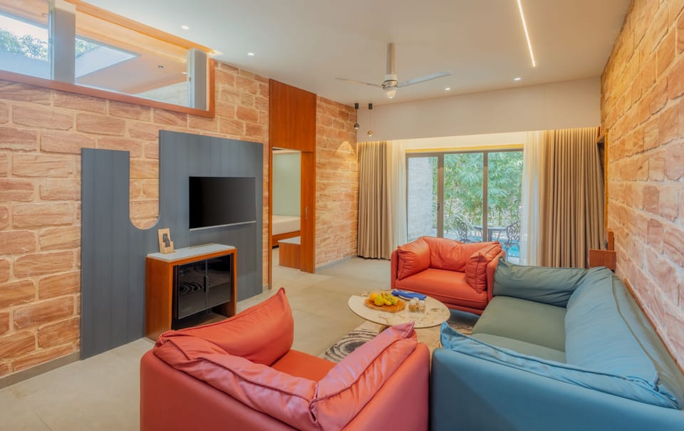 Suite with Private Pool | Living area | 42-inch Smart TV with digital channels, foosball, table tennis