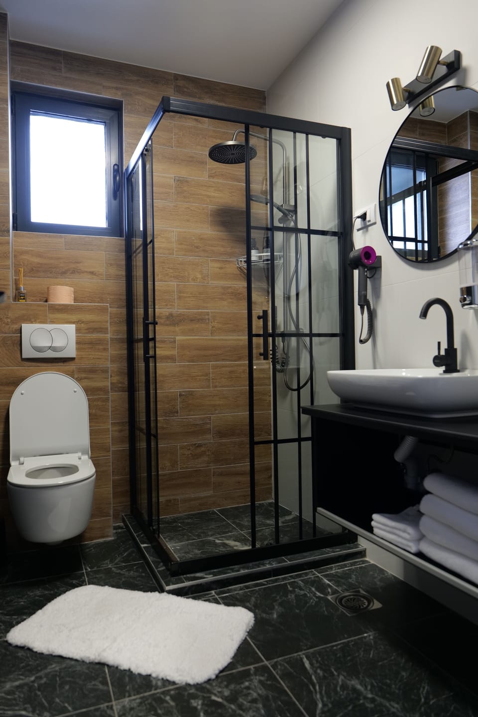 Shower, hair dryer, slippers, towels