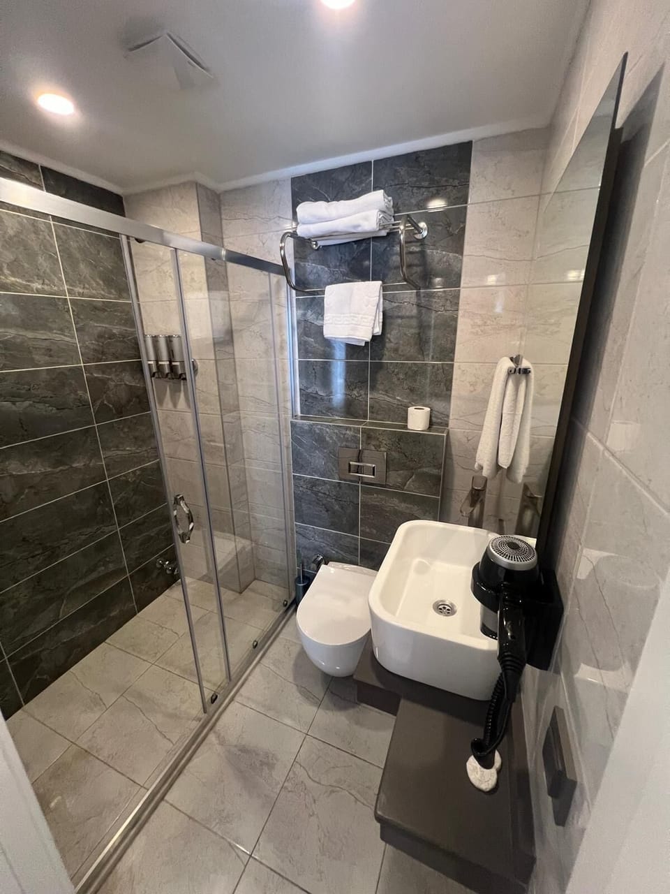 Shower, free toiletries, hair dryer, slippers