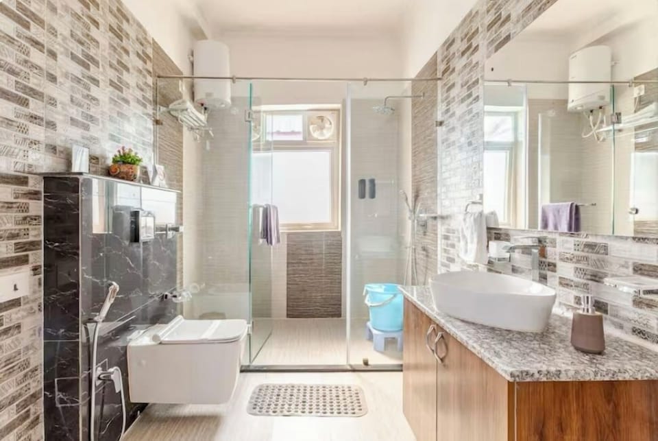 Shower, free toiletries, slippers, towels