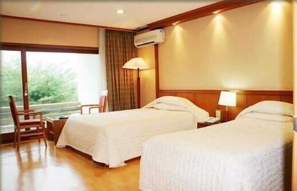 Twin Room, Mountain View | Minibar, desk, laptop workspace, blackout drapes