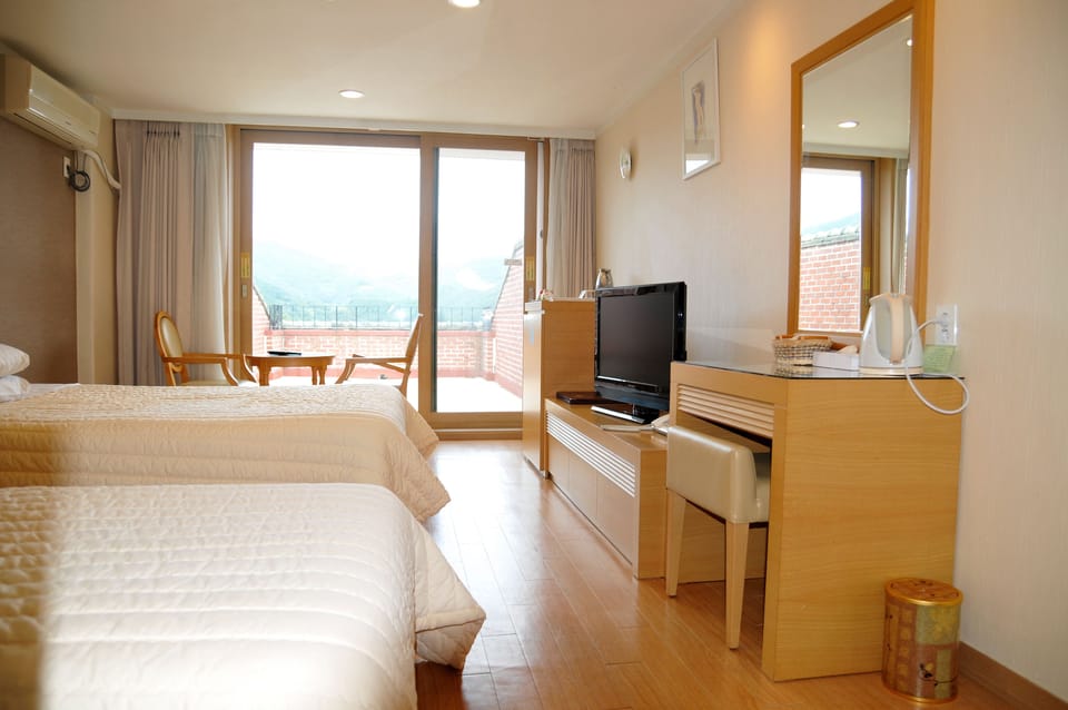 Twin Room, Mountain View | Minibar, desk, laptop workspace, blackout drapes