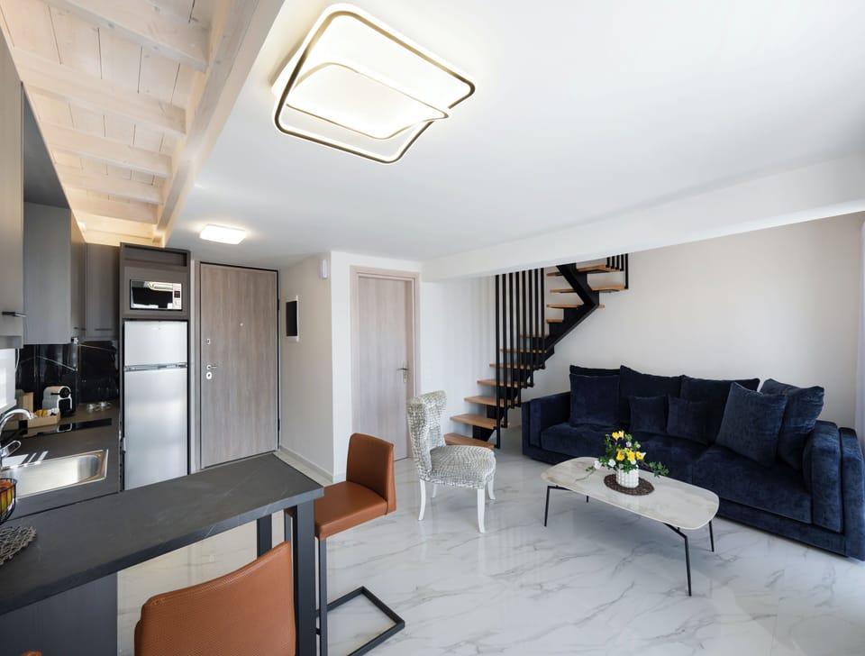 Deluxe Duplex, Sea View | Living area | TV