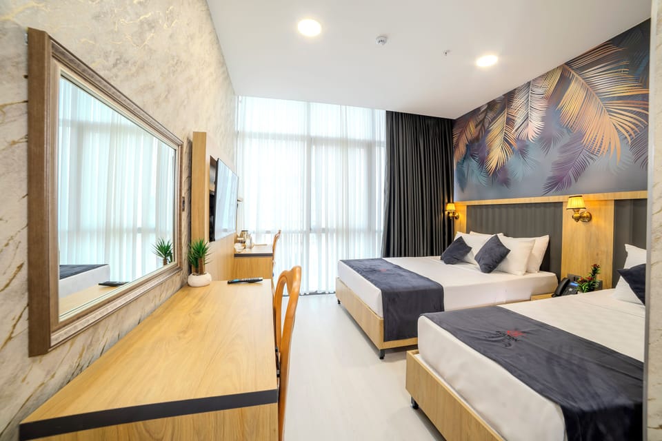 Deluxe Triple Room | Hypo-allergenic bedding, memory foam beds, free minibar items