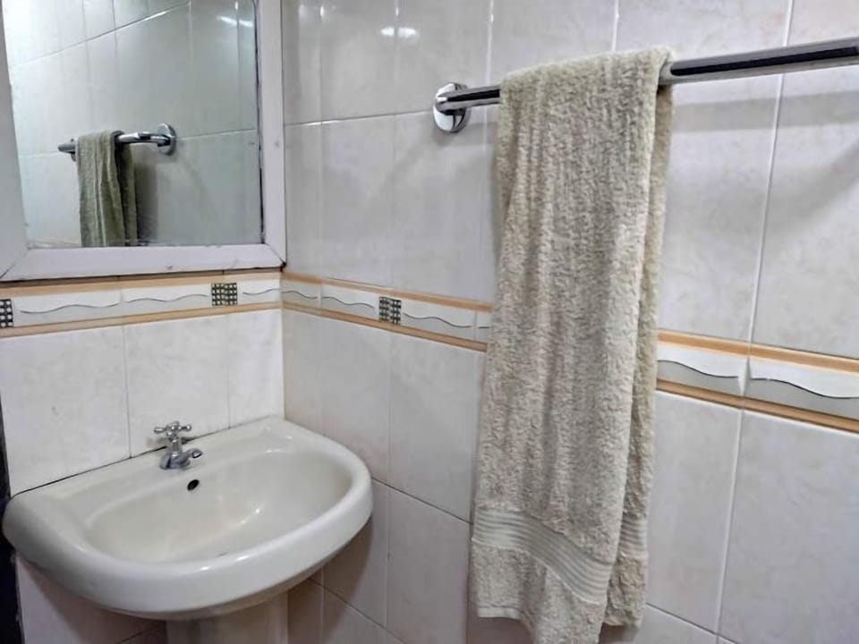 Shower, slippers, towels, soap