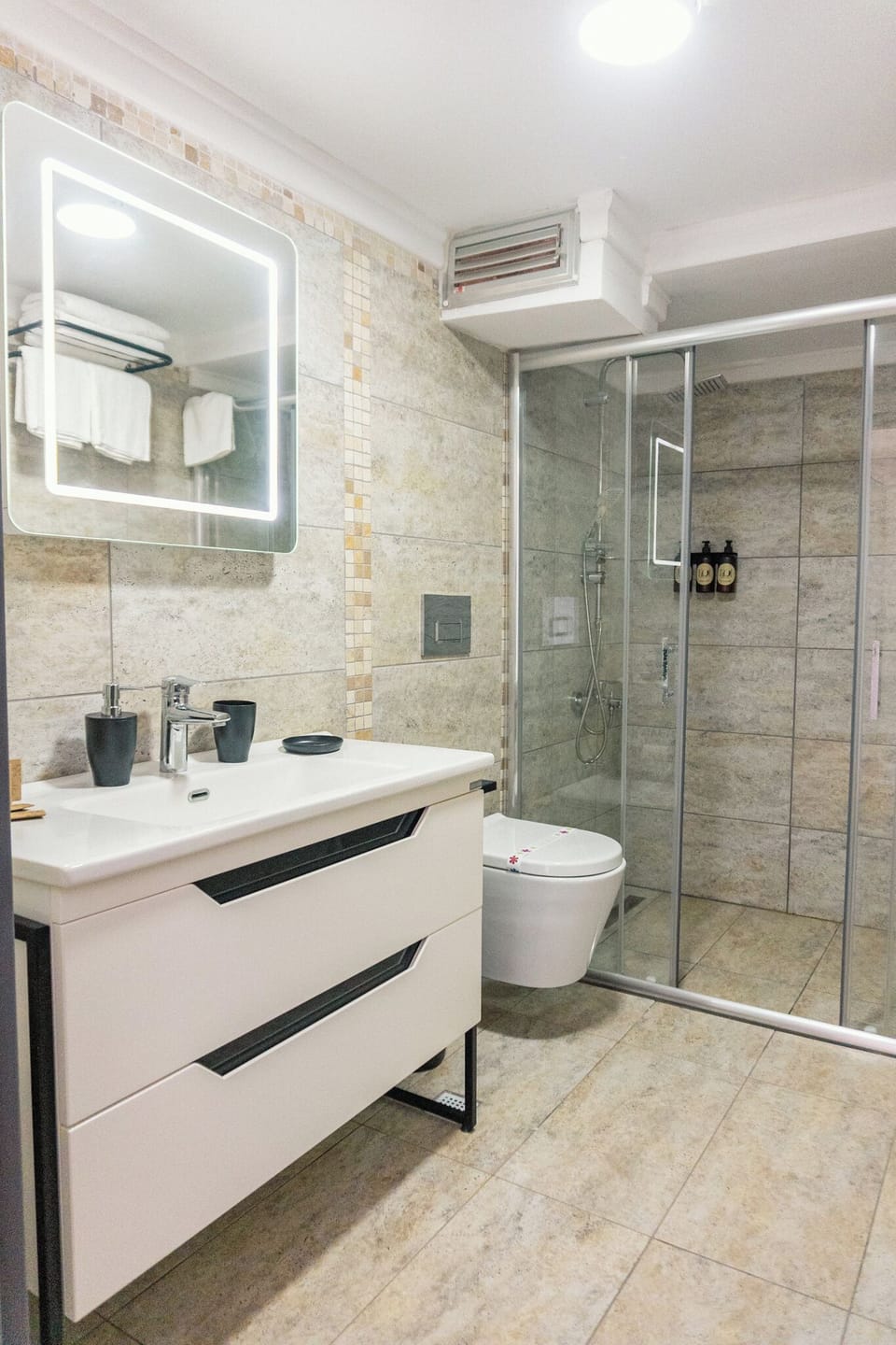 Deluxe Room, Multiple Beds, Terrace, Partial Sea View | Bathroom | Shower, hair dryer, towels, soap