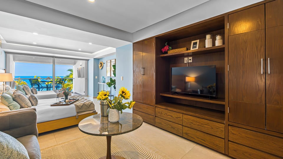 Comfort Apartment, 2 Queen Beds, Balcony, Beach View | Living area | 49-inch Smart TV with cable channels, Netflix, streaming services