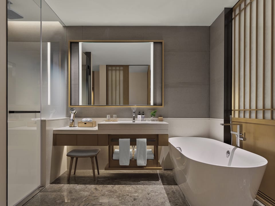Separate tub and shower, free toiletries, hair dryer, bathrobes