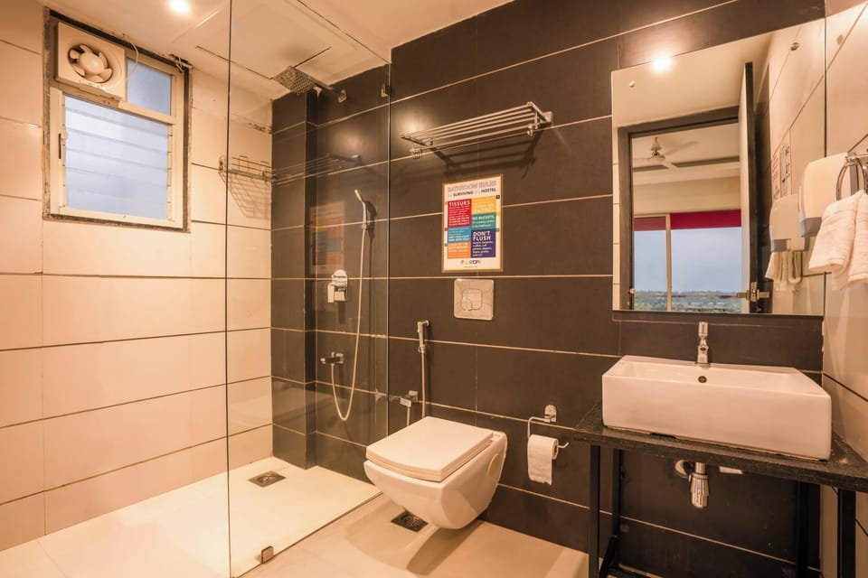 Bed in 10 Bed Mixed A/C Dormitory Room with Ensuite Bathroom | Bathroom | Shower, toilet paper