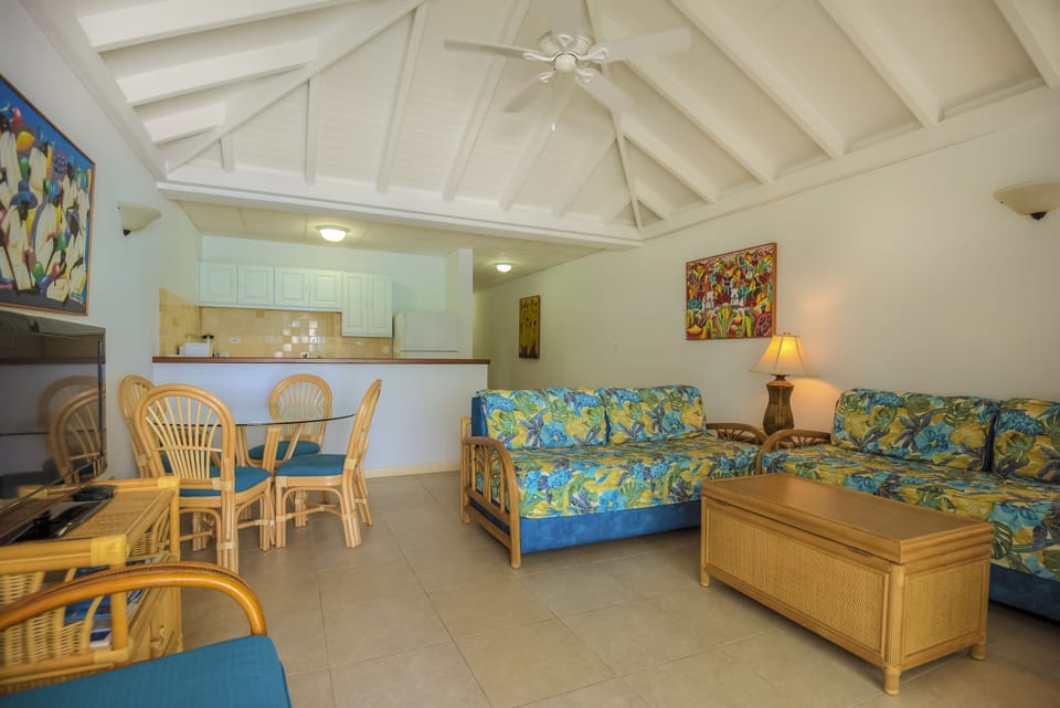 Deluxe Room, 1 Bedroom, Balcony, Oceanfront | Living area | Flat-screen TV, DVD player