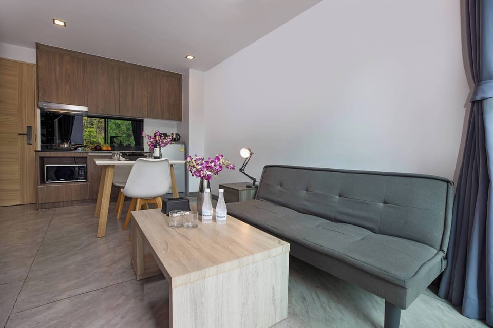 Design Apartment, 1 Bedroom, Balcony | Living area | 36-inch flat-screen TV with cable channels