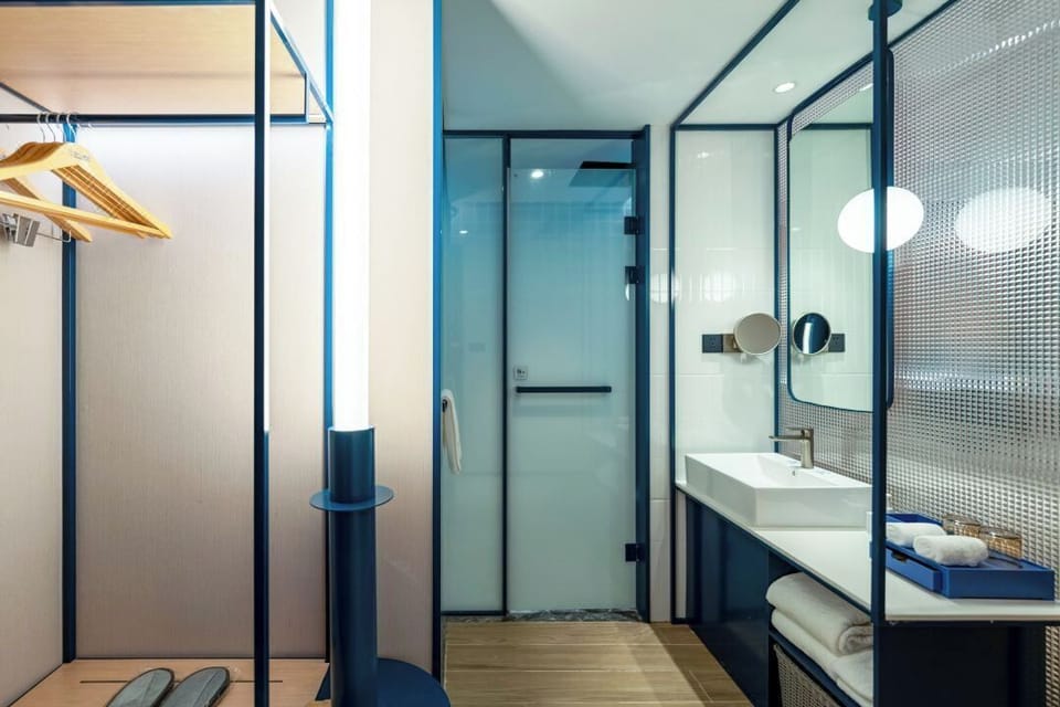 Shower, free toiletries, hair dryer, slippers