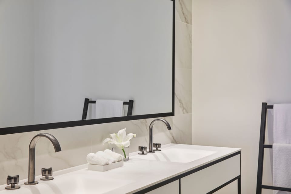 Shower, designer toiletries, hair dryer, bathrobes