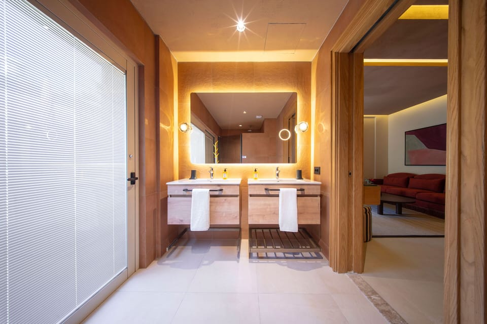Sole Private Suite with Hot Tub | Bathroom | Designer toiletries, hair dryer, slippers, towels