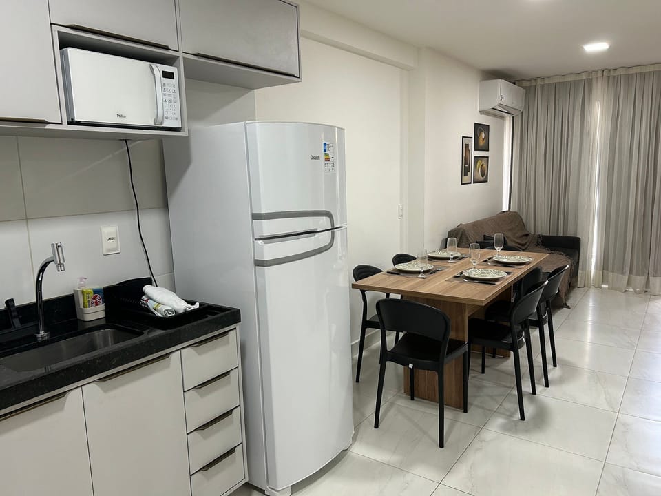 Family Apartment | Private kitchen | Cookware/dishes/utensils, dining tables
