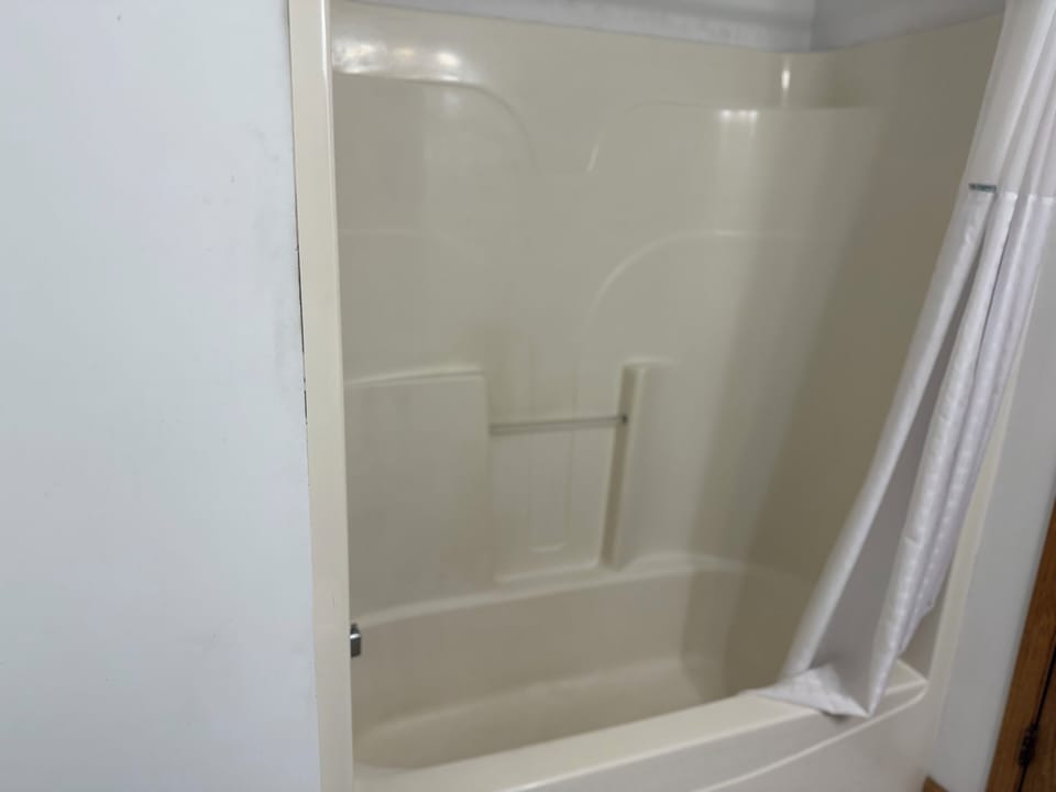 Room, 2 Queen Beds, Courtyard View | Bathroom | Combined shower/tub, towels, soap, shampoo