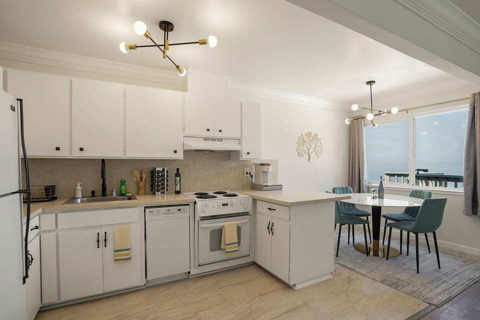 Family Apartment, 2 Bedrooms, Balcony, Ocean View | Private kitchen | Coffee/tea maker, dining tables