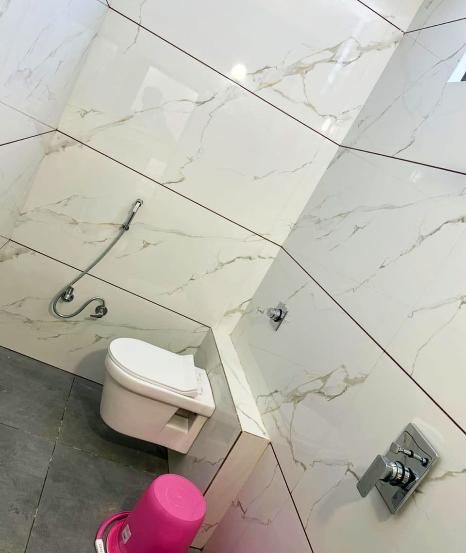 Deluxe Quadruple Room | Bathroom | Shower, free toiletries, slippers, soap