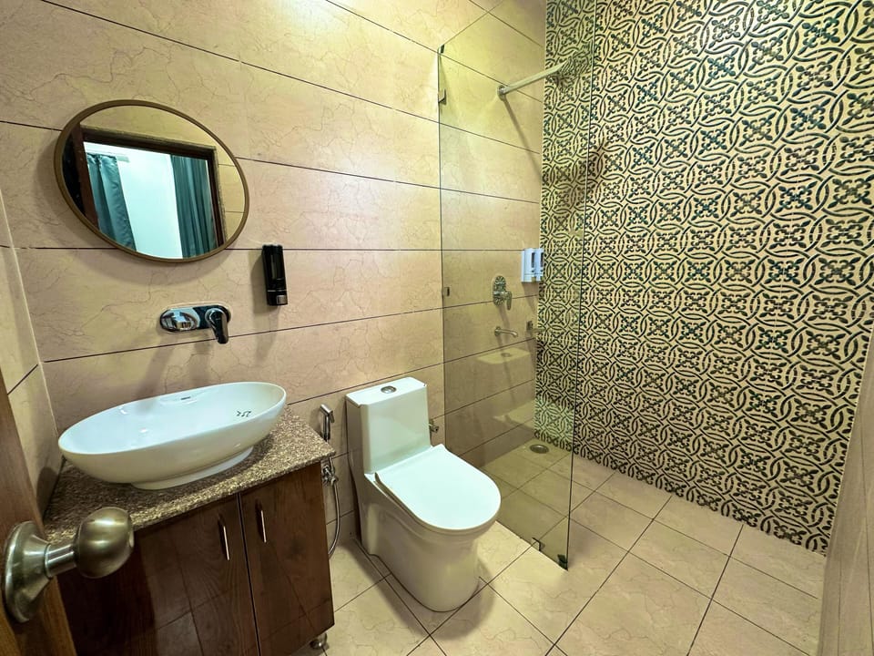 Shower, free toiletries, slippers, towels