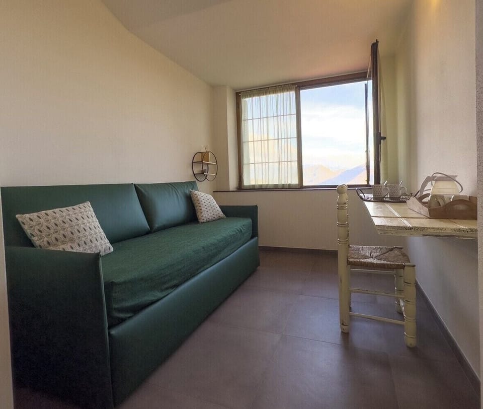 Deluxe Triple Room, Mountain View | In-room safe, blackout drapes, iron/ironing board, free WiFi