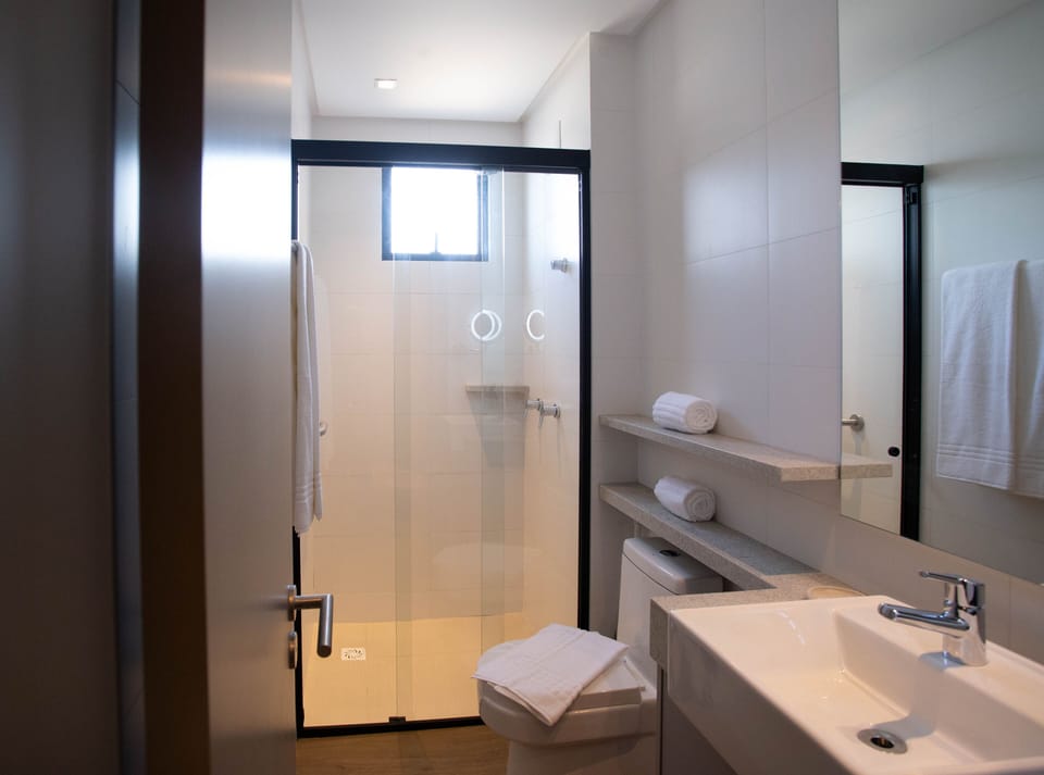 Designer toiletries, hair dryer, towels, soap