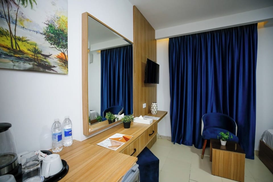 Deluxe Double or Twin Room | Desk, laptop workspace, blackout drapes, iron/ironing board