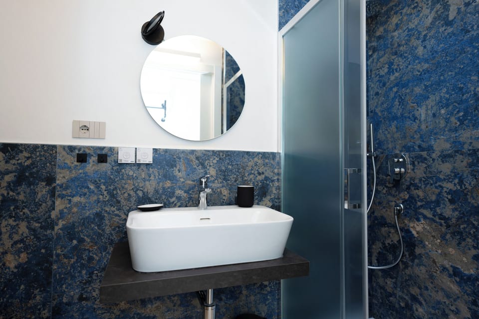 Family Triple Room, Patio | Bathroom | Shower, free toiletries, hair dryer, slippers