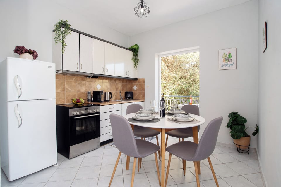 Apartment, 2 Bedrooms, Garden View | Private kitchen | Highchair, cookware/dishes/utensils