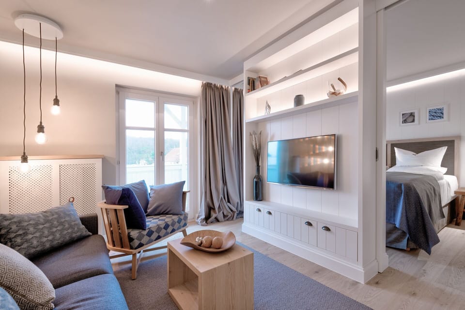 Junior Suite | Living area | 43-inch flat-screen TV with cable channels, TV, tablet