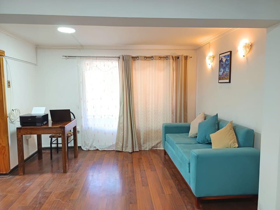 Family Triple Room, City View | Living area