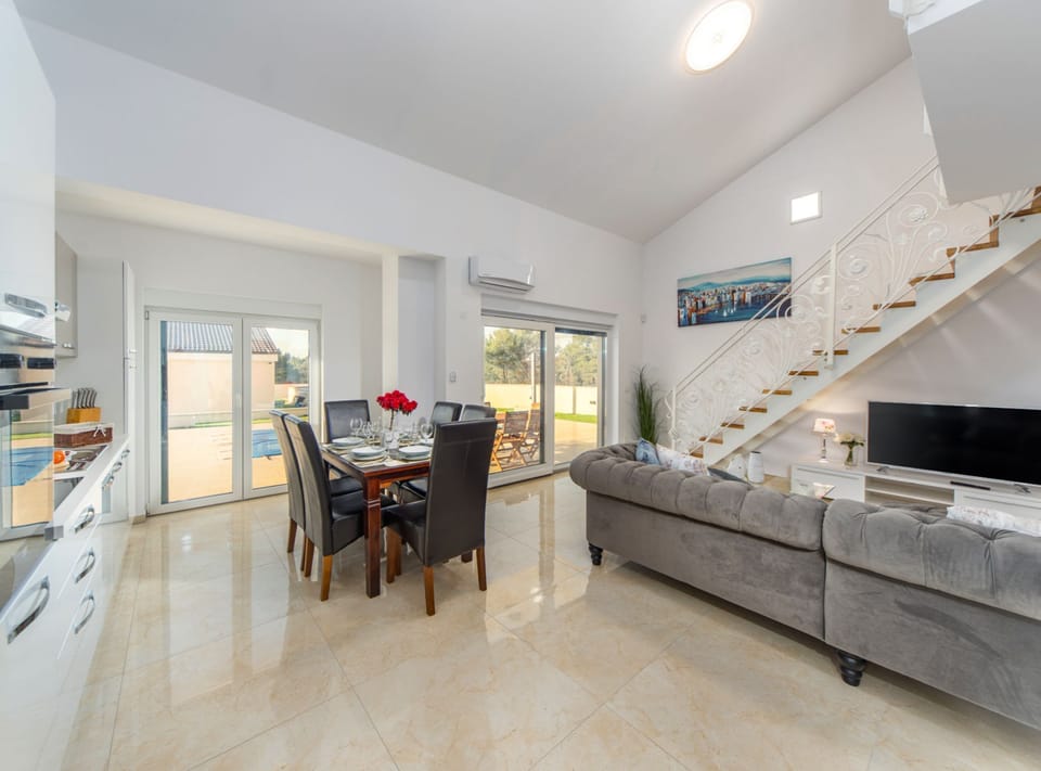 Villa (Three Bedroom House with Pool) | Living room | 32-inch flat-screen TV with cable channels
