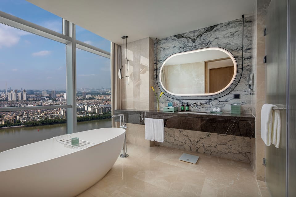 One Bedroom Suite River View | Bathroom | Rainfall showerhead, free toiletries, hair dryer, bathrobes