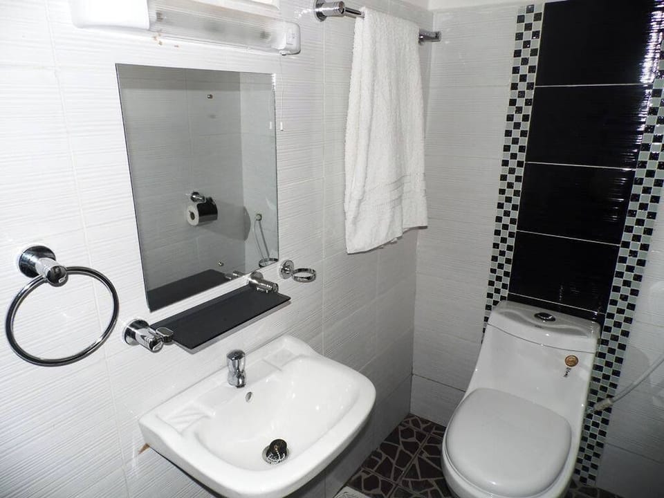 Shower, slippers, towels, soap