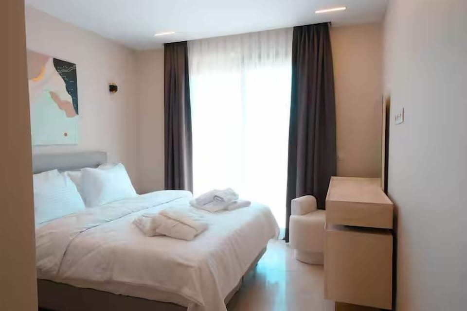 Premium bedding, down comforters, desk, laptop workspace