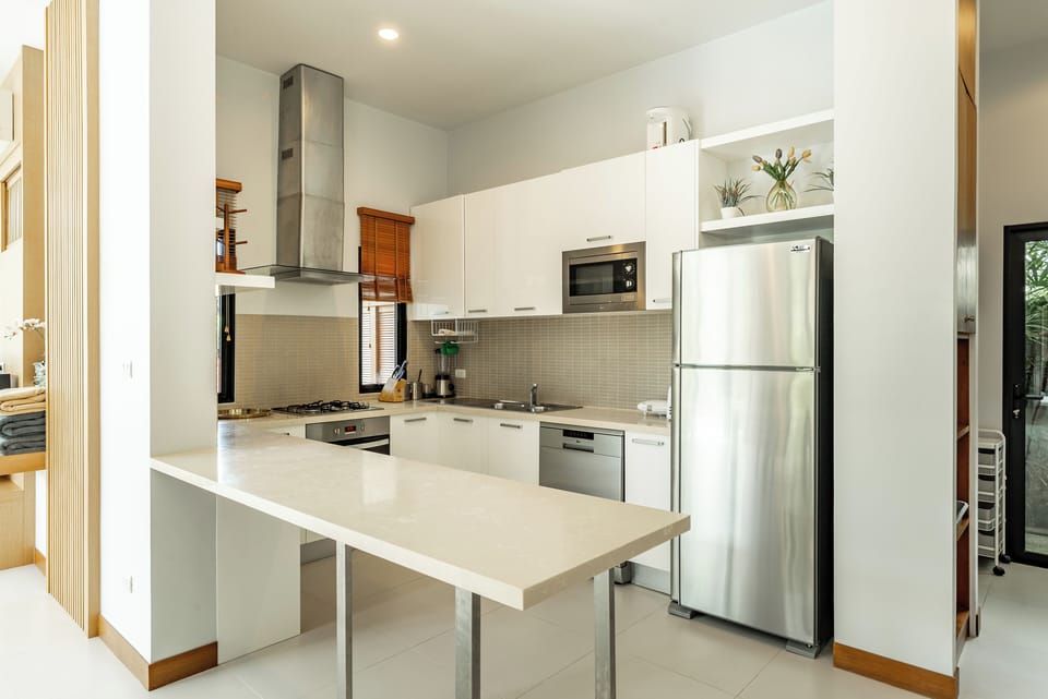 Family Villa | Private kitchen | Electric kettle, dining tables