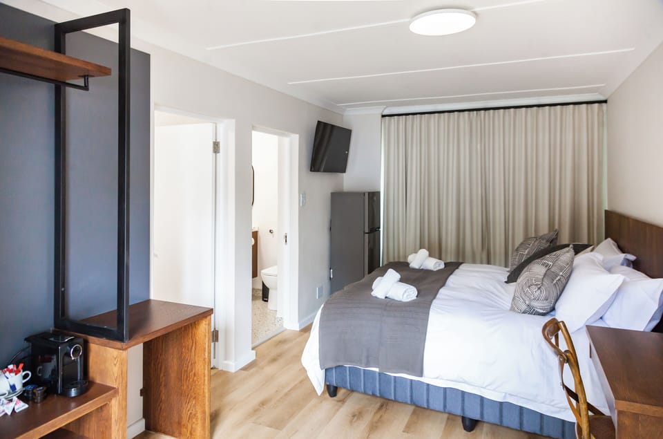 Family Quadruple Room, Patio, Garden View | In-room safe, desk, soundproofing, iron/ironing board